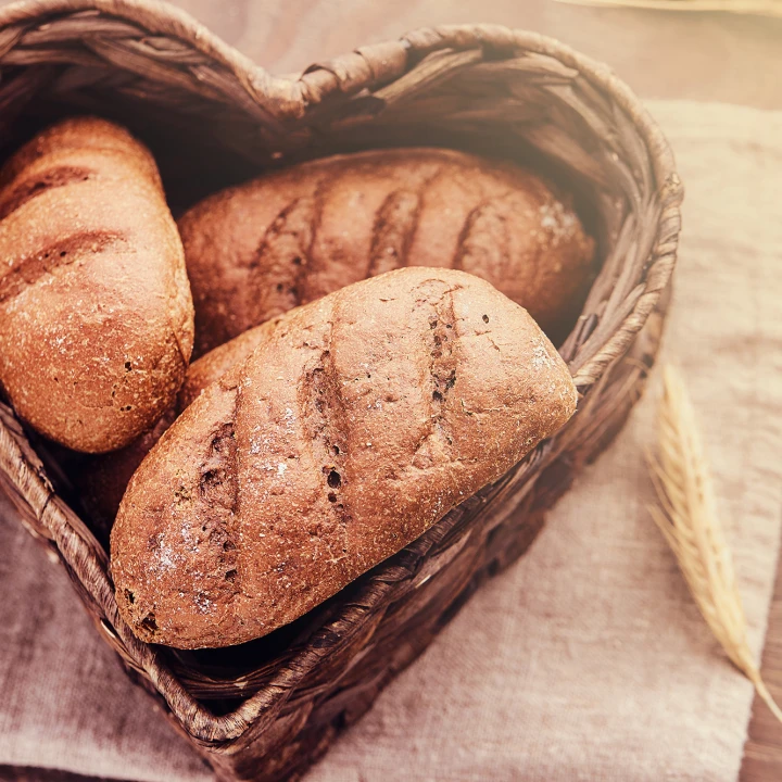 Hot freshly buns in a heart-shaped basket.